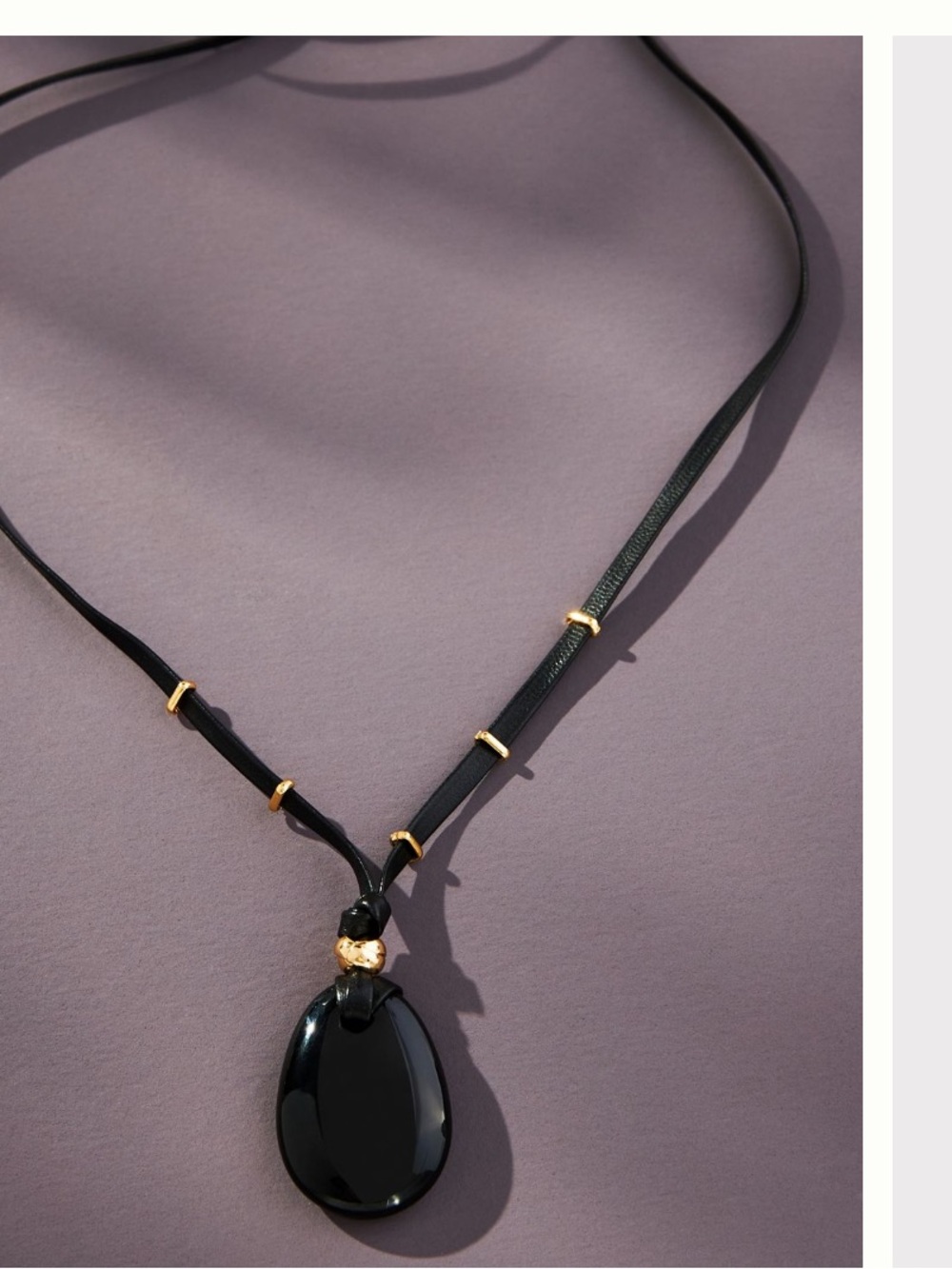 Black stone like Pendant Necklace with Gold Accents tie adjustable .